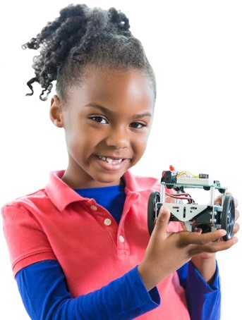 A young girl with curly hair is smiling and holding a small robotic vehicle. She is wearing a pink polo shirt over a blue long-sleeve top. The background is white, making the girl and the robot the focal points of the image.